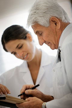 View of two doctors involved in a discussion.