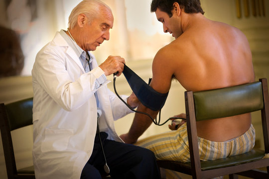 View of a doctor checking up a patient.