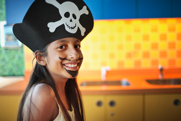 Portrait of young girl dressed up as a pirate.