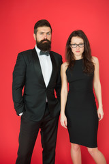 Formal couple of man in tuxedo and sexy woman. Bearded man and woman in formal dress. couple in love on date. business meeting. formal fashion look. Proposal or engagement party. Used to look perfect
