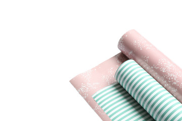 Obraz premium Rolls of festive wrapping paper on white background. Space for text