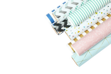 Rolls of festive wrapping paper on white background. Space for text