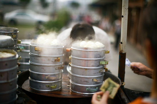 Steamed food being prepared.