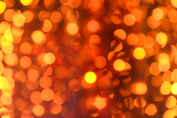 Blurred orange lights as background, space for text