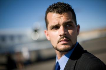 Mid-adult businessman at an airport.
