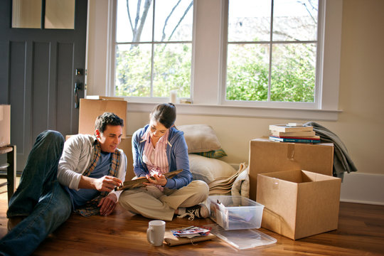 Couple moves into new house and begins unpacking
