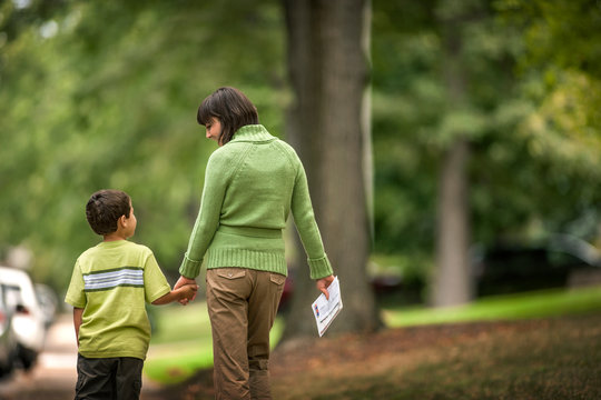 Mother and son walking together.