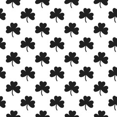 Seamless pattern withsigns of shamrocks.