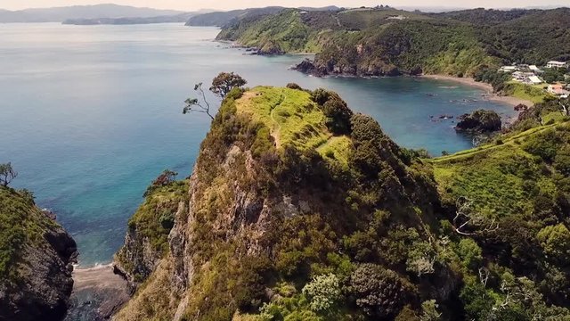 Drone view of Tapeka point, Russell Island, New Zealand. Pull out shot