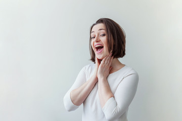 Happy girl smiling. Beauty portrait young happy positive laughing brunette woman on white background isolated. European woman. Positive human emotion facial expression body language