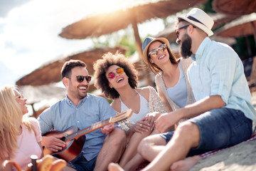Friends having funon the beach