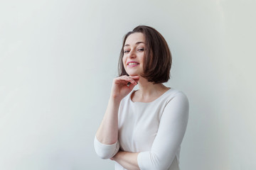 Happy girl smiling. Beauty portrait young happy positive laughing brunette woman on white...