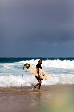 Man Walking Away From The Surf