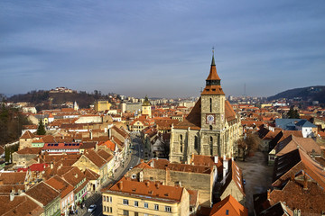 Naklejka na ściany i meble Panoramic view of the old town in the winter time, Aerial cityscape of Brasov city, Transylvania landmark in Brasov, Romania