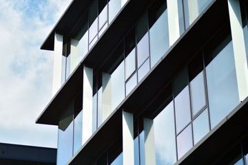 Sky reflected in a modern building glass facade