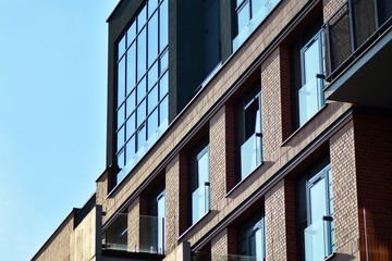 Fototapeta na wymiar Modern condo building with huge windows