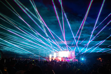 Night concert lights at the festival with lasers