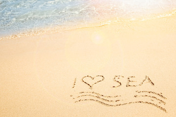 Beautiful drawing on the sand of the sea background