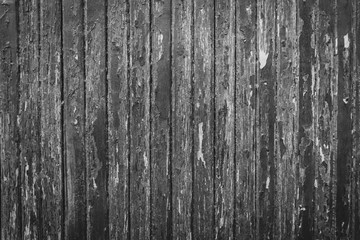 Rough wooden planks in black and white.
