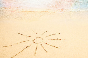Beautiful drawing on the sand of the sea background