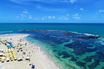 Aerial view of Porto de Galinhas's Beach, Pernambuco, Brazil: Vacation on the paradisiac beach with fantastics natural pools. 