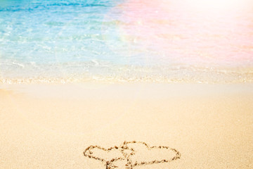 Beautiful drawing on the sand of the sea background
