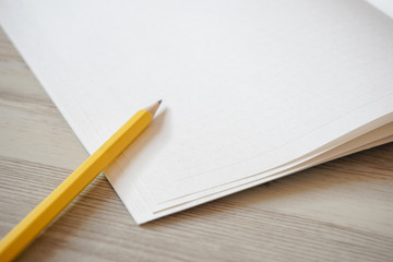 Note and pencil on the desk.  デスクの上のノートと鉛筆