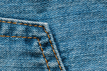 Blue denim jean texture. Macro close up of blue jeans. Fabric material background.