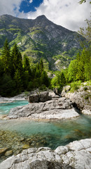 Turquoise water and karst limestone of Soca river in Trenta Valley at Vrsnica Gorge Natural Monument Triglav National Park Slovenia