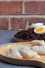 steamed pangasius dory and riceberry rice on wooden plate