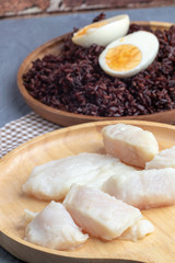 Fototapeta na wymiar steamed pangasius dory and riceberry rice on wooden plate