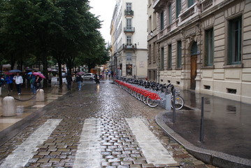 Lyon France, rainy street, cold afternoon, wet floor, bicycles, old town, landscape