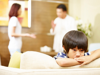 unhappy child and quarreling parents