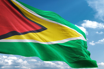 Guyana flag waving sky background 3D illustration