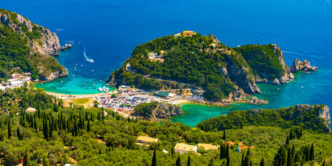 Panoramic view of Palaiokastritsa, boats and beach Corfu, Greece - obrazy, fototapety, plakaty