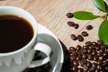 coffee in white cup on wooden table