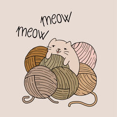 baby cat playing with balls of wool