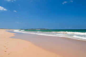 Fototapeta premium Picturesque summer landscape of empty beach on clear day