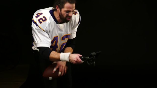 American Football Player reports to social networks using a smartphone
