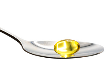 fish oil vitamin on spoon on white background with clipping path.