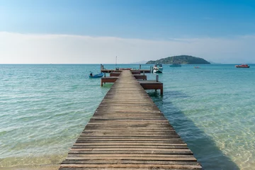 Fotobehang Wooden pier with boat in Phuket, Thailand. Summer, Travel, Vacation and Holiday concept. © ake1150