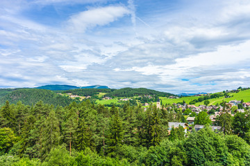 Alpe di Siusi, Seiser Alm with Sassolungo Langkofel Dolomite, a large green field with trees in the background