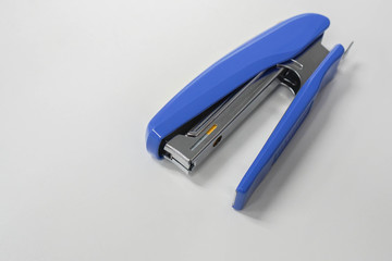 isolated top view office stationary of big blue stapler