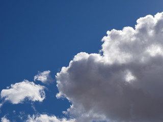 Vibrant blue sky with fluffy clouds