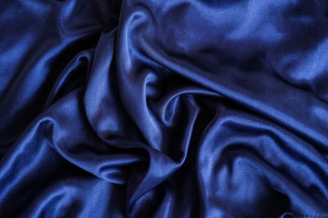 Fabric blue waves - material for background and texture.