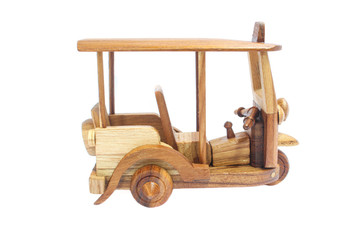 Fototapeta premium Wooden Tuk Tuk Taxi model. Three-Wheels on isolated photo