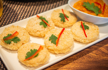 Rice Cracker with Dipping Sauce on table