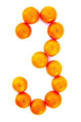 Number solved with tangerines isolated on white background. Mandarine number «3»