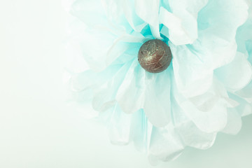 Round chocolates on a gentle blue background. Copy space. View from above.