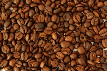dark roasted coffee beans closeup as  background top view 